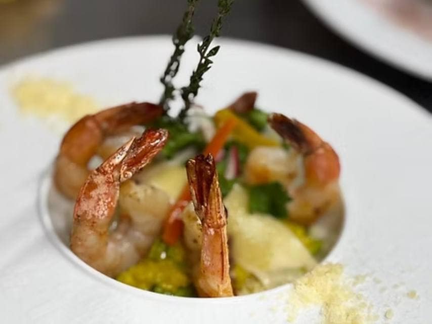 A gourmet French-Caribbean seafood dish at L’Auberge Gourmande brings refined culture and flavours to Leeward Island charters in St Martin.