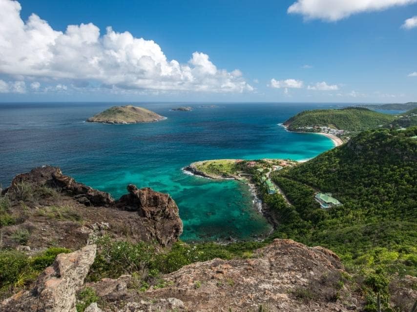 A luxury Yacht charter Leeward Islands itinerary takes guests to St Barths, with powdery sands and turquoise bays.