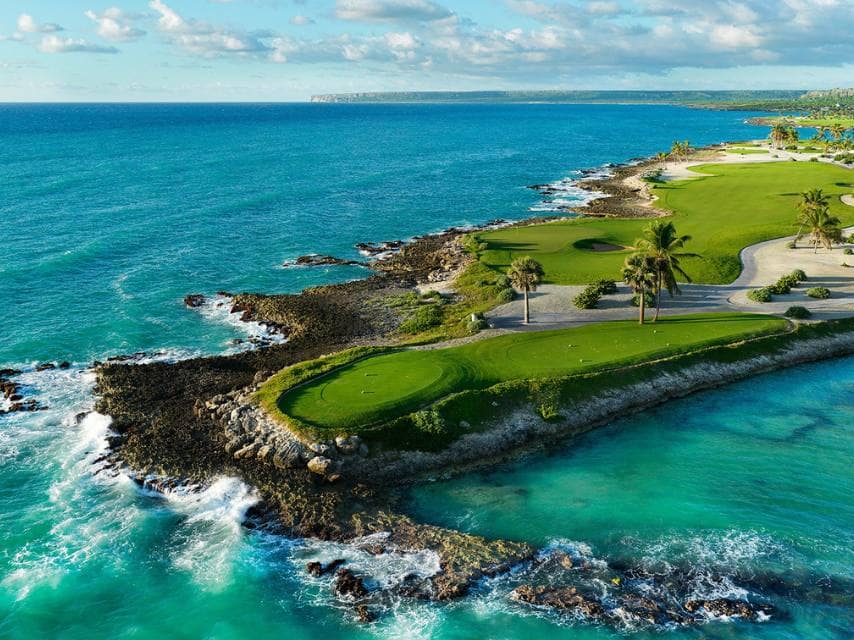 Luxury Caribbean yacht charter views of Eden Roc Golf course with cliffs above the sea.