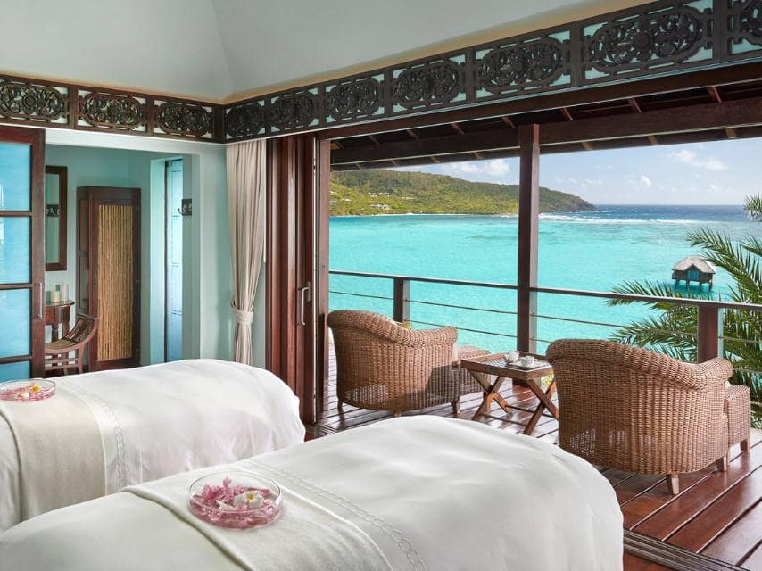 One of the best luxury spas in Caribbean, Mandarin Oriental in Canouan boasts a serene treatment room with ocean views.