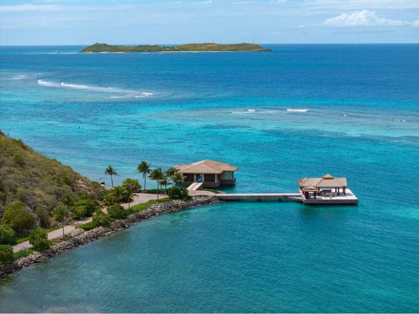 The highlight of a spa retreat Caribbean yacht journey are these overwater massage pavilions in Sundara Spa at Oil Nut Bay.