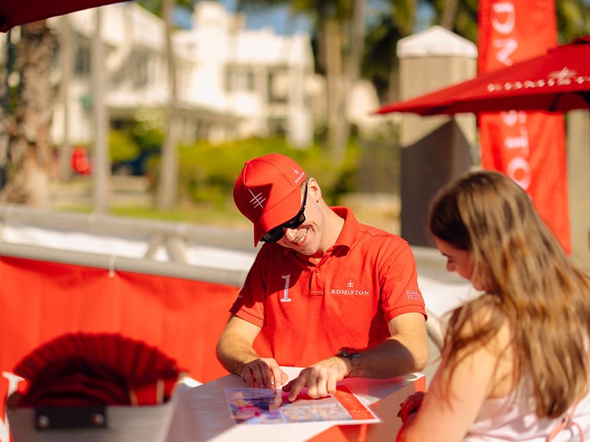 Superyacht Show Palm Beach guests watch as an Edmiston staff member identifies key vessels on the show map.