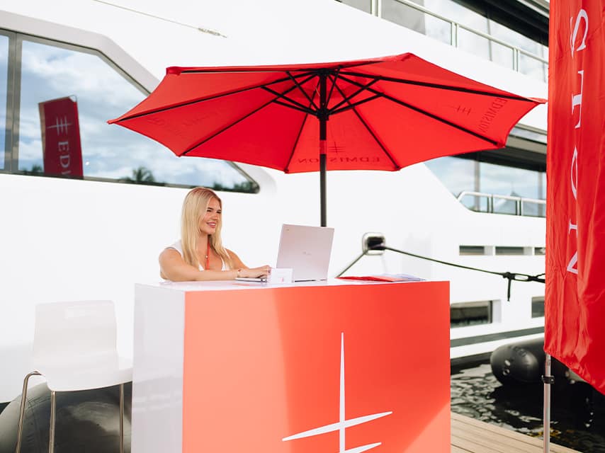 The Palm Beach Boat Show 2026 begins as an Edmiston hostess welcomes guests boarding a magnificent superyacht.