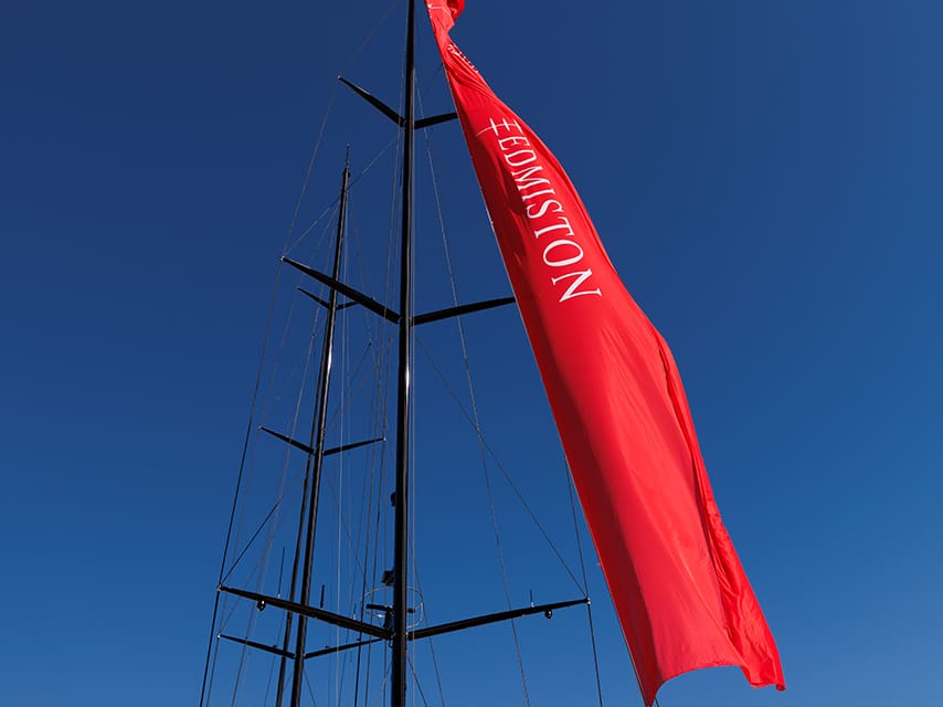 The Edmiston flag at the Palm Beach International Boat Show 2026 proudly signals expert sales and charter services.