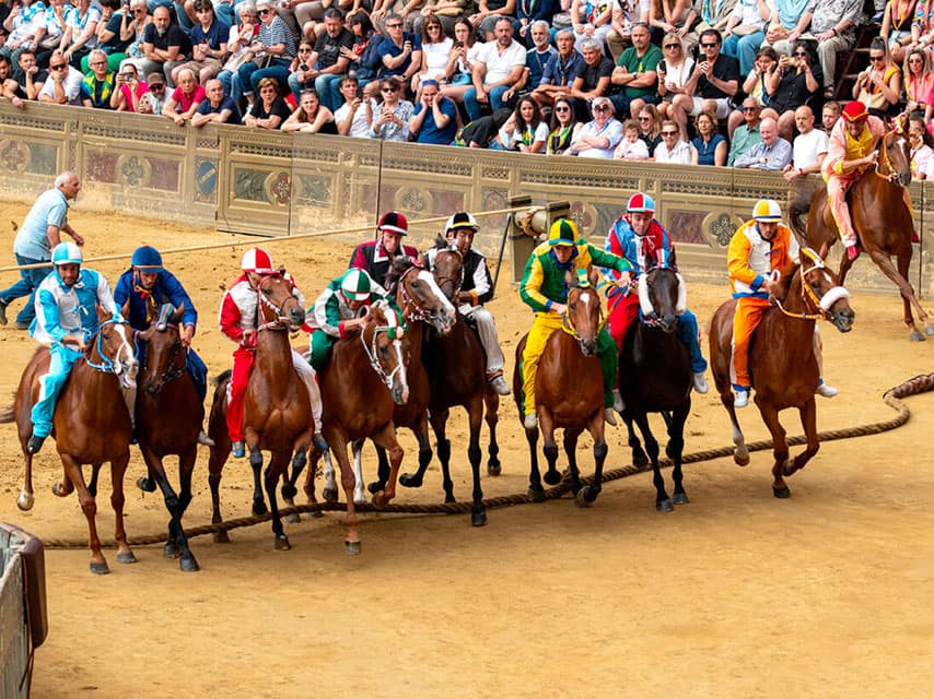 Luxurious events like the Palio di Siena feature a dramatic horse race where riders in colourful silks compete bareback.