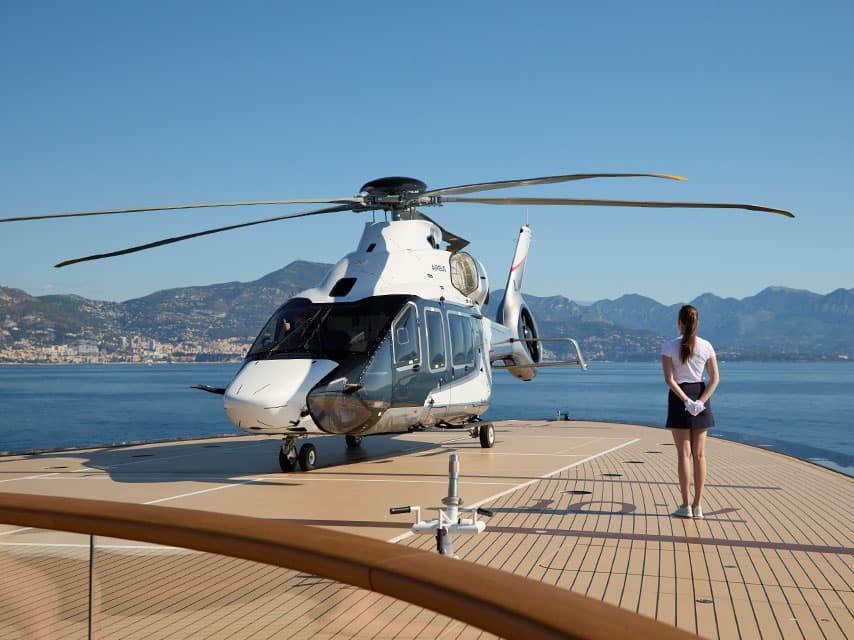 Helicopter landing on private luxury superyacht