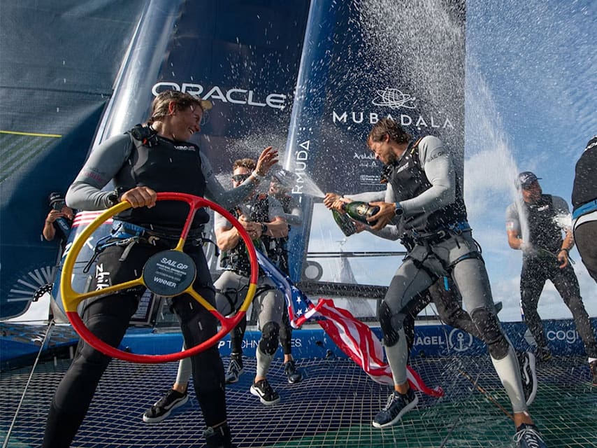 Luxurious events such as Sail GP feature the team USA's champagne victory onboard their catamaran in the Valencia marina.