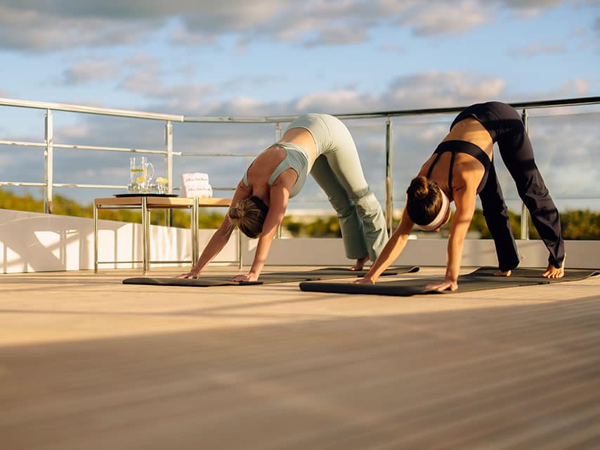 Yoga on deck on a private luxury yacht charter in Greece