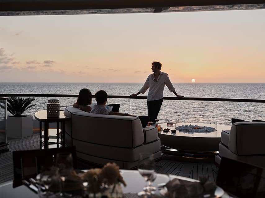 Sunset drink on deck of a luxury superyacht