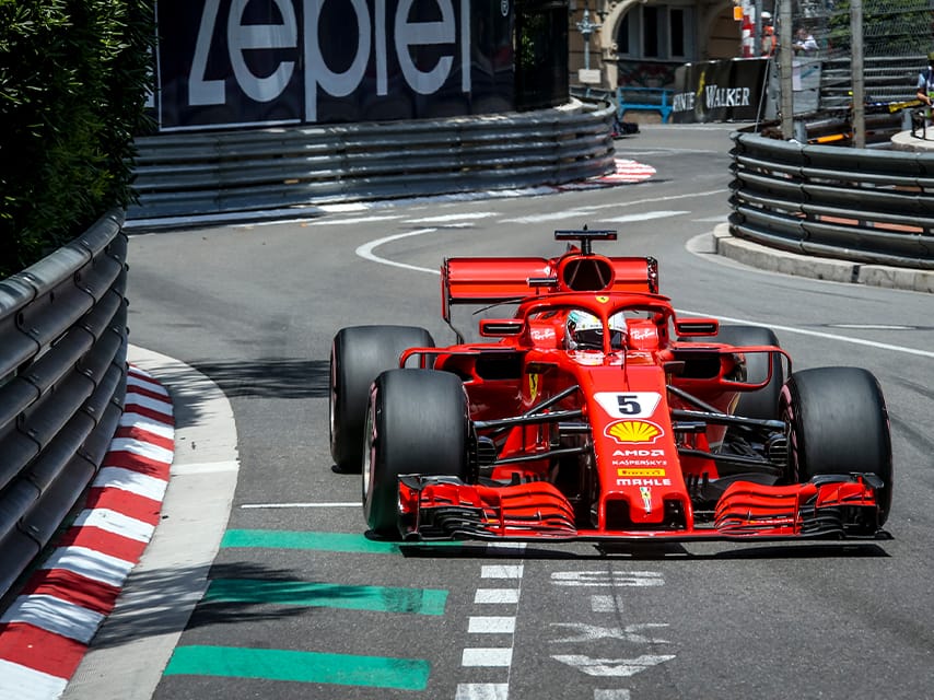 View of an F1 car on the racetrack, to be enjoyed with a Monaco F1 yacht package