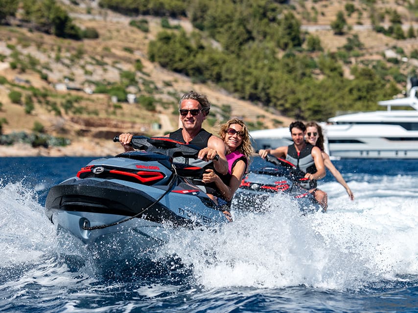 People enjoying jetskis as part of their Monaco Grand Prix yacht package