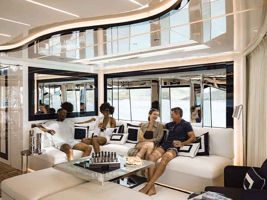 People enjoying drinks on their Monaco Grand Prix yacht charter