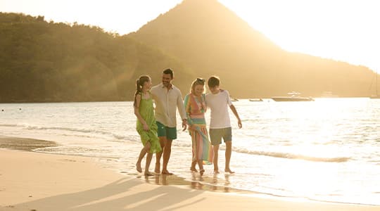 A family enjoying unforgettable moments in the Bahamas, a top yacht charter destination for 2024.