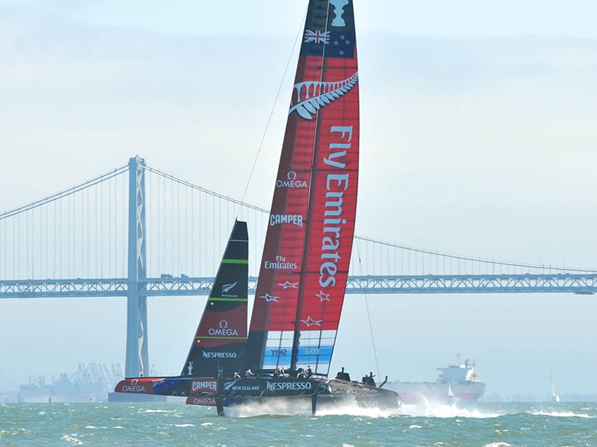 A front row view of a racing boat in the 2024 America's Cup yacht racing events from a private Barcelona yacht charter.