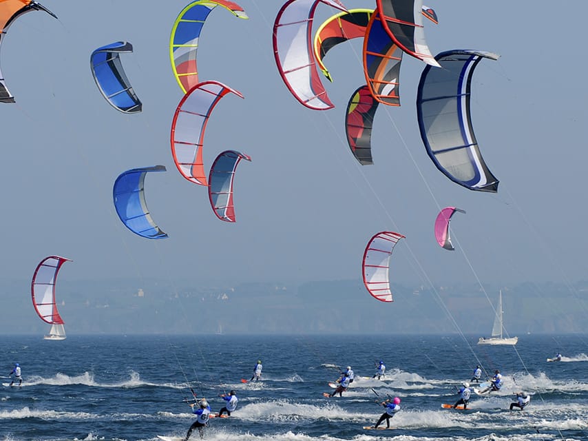 Kitesurfing athletes training in Marseille, a must-visit destination on your Paris 2024 yacht charter.