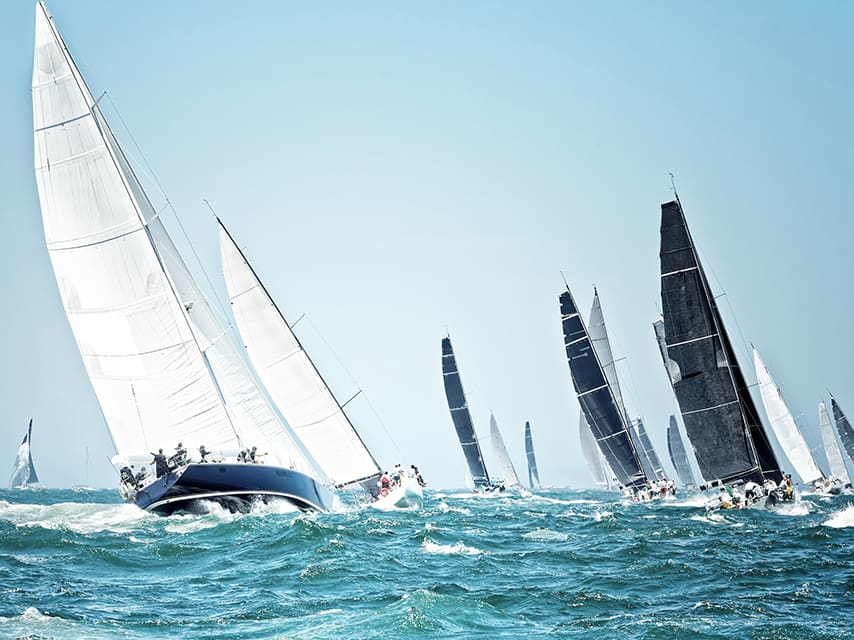 Enjoy a privileged view of the beautiful sailboats in the yacht racing events from the deck of your America’s Cup yacht charter.