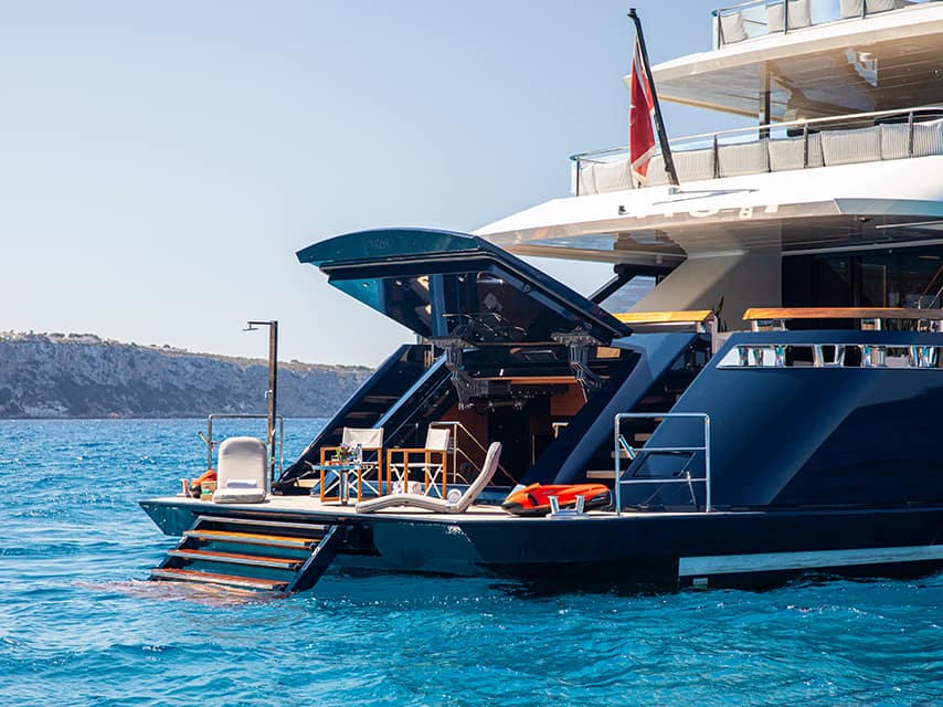 The rear deck of a beautiful pre-owned yacht purchased with the help of Edmiston's yacht buying guide.