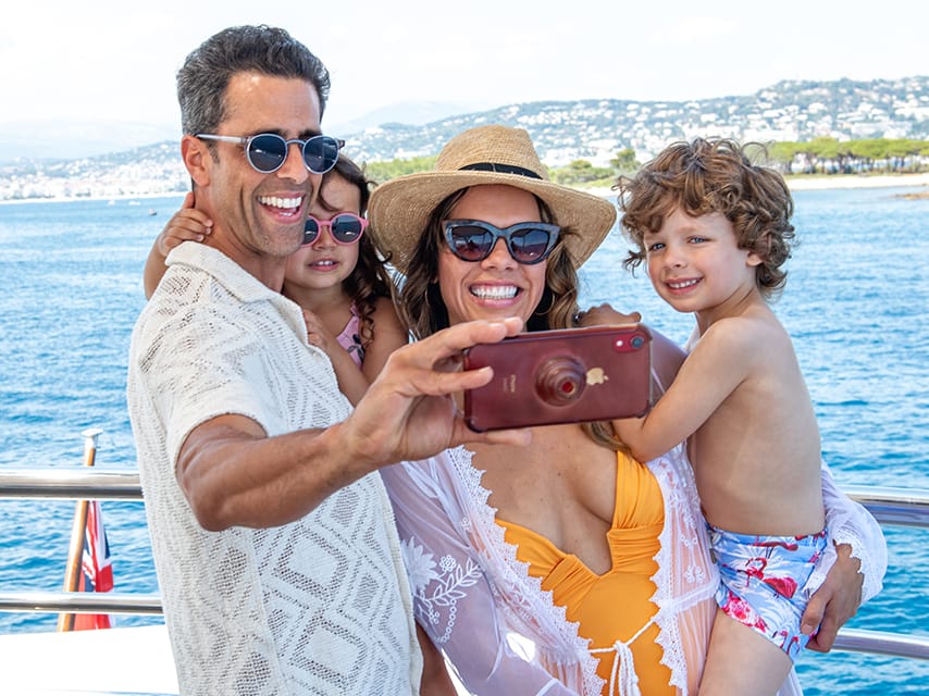 A family captures a special moment aboard their luxury French Riviera yacht charter.