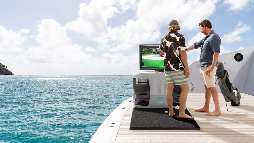 Two friends enjoying a game of golf with their new yacht accessories