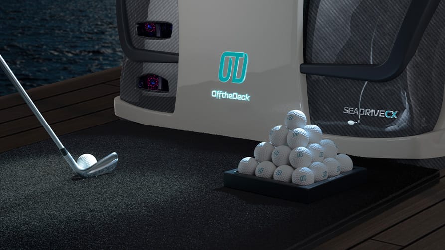 Superyacht golf, one of the top yacht accessories of the year, set up on the deck of a luxury yacht