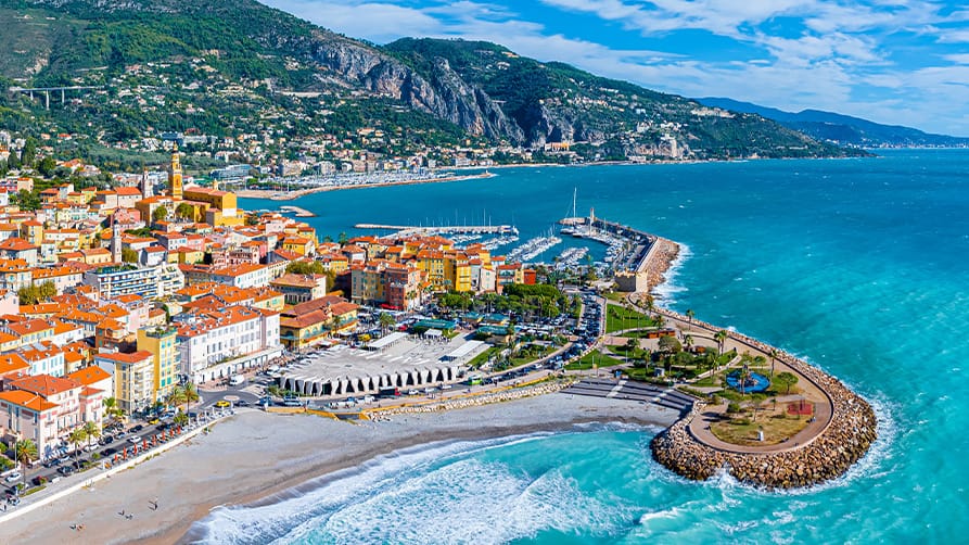 An aerial view of Menton, France, home of The Fête du Citron, an exquisite experience in French Riviera Cuisine, and an excellent destination for your French Riviera Yacht charter.