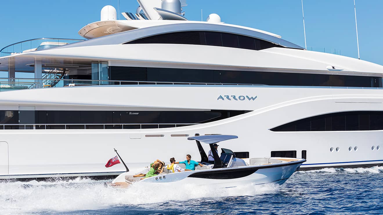 http://Friends%20arriving%20on%20their%20exclusive%20mega%20yacht%20charter.
