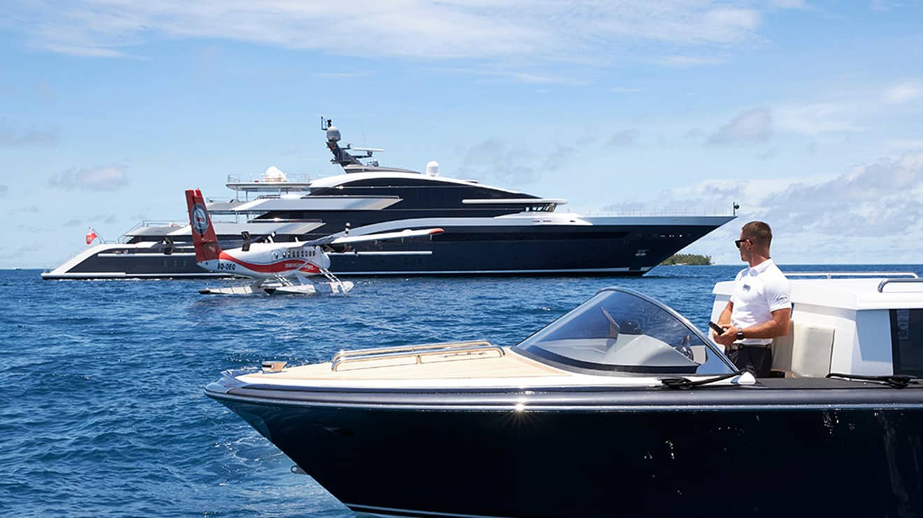 An airplane and a yacht from luxury yacht builders Edmiston