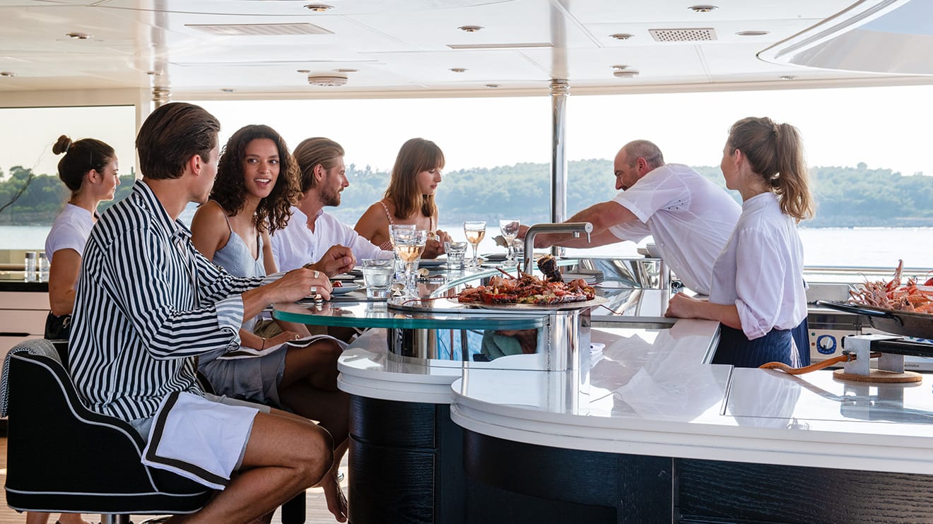 People eating food on a luxury superyacht for charter