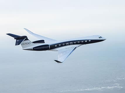 An airplane traveling to the Monaco Yacht Show