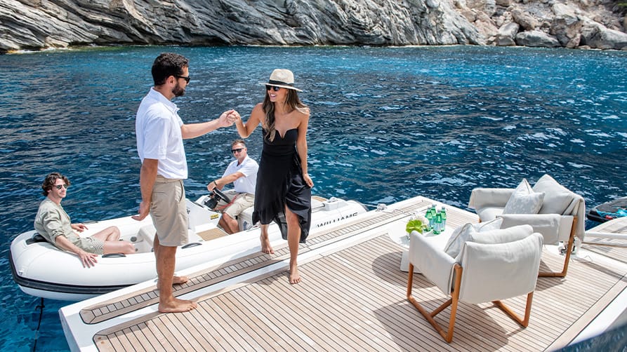 A woman being welcomed aboard, ready to embrace her luxury superyacht lifestyle.