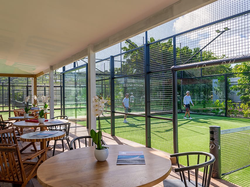 Padel players at Le Domaine Padel court